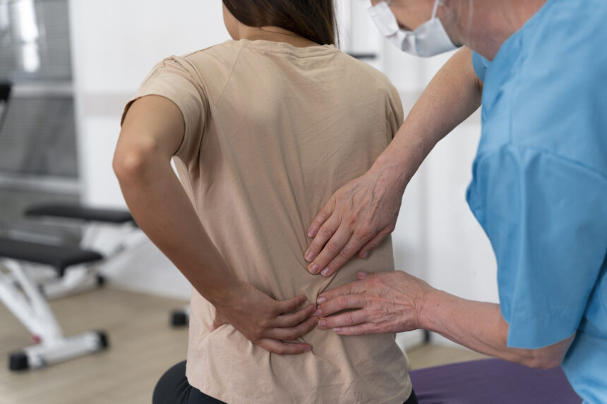 medical-assistant-helping-patient-with-physiotherapy-exercises